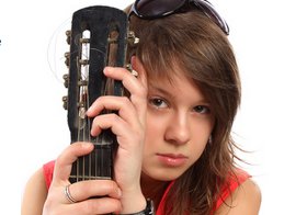girl musician playing guitar